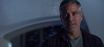 Movie still from “Tomorrowland” (2015), directed by Brad Bird – A person wearing a plaid shirt; Close Up shot, Over the shoulder angle