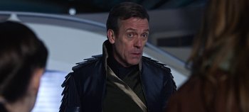 Movie still from “Tomorrowland” (2015), directed by Brad Bird – A person wearing a jacket; Close Up shot, Over the shoulder angle