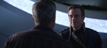 Movie still from “Tomorrowland” (2015), directed by Brad Bird – A man in a leather jacket talking to another man in a leather jacket; Close Up shot, Over the shoulder angle