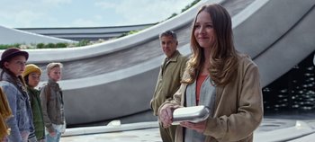 Movie still from “Tomorrowland” (2015), directed by Brad Bird – A man and a woman standing next to each other; Medium shot, Over the shoulder angle
