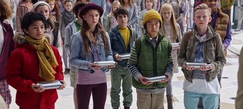 Movie still from “Tomorrowland” (2015), directed by Brad Bird – A group of young people standing next to each other holding nintendo wii controllers; Medium shot, High angle