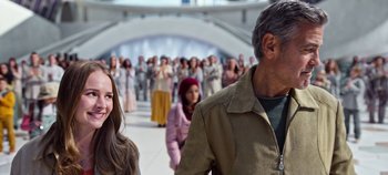 Movie still from “Tomorrowland” (2015), directed by Brad Bird – A group of people standing in a room; Medium shot, Over the shoulder angle
