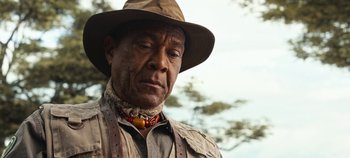 Movie still from “Tomorrowland” (2015), directed by Brad Bird – An older man wearing a hat and a necklace; Close Up shot, Low angle