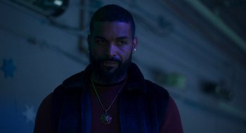 Movie still from “Too Old to Die Young” (2019), directed by Nicolas Winding Refn – A person with a beard; Close Up shot, Low angle