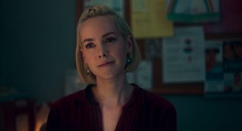 Movie still from “Too Old to Die Young” (2019), directed by Nicolas Winding Refn – A woman with blonde hair wearing a red shirt; Close Up shot, Over the shoulder angle