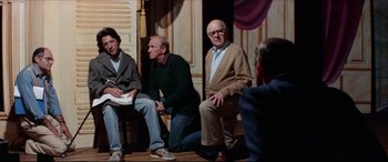 Movie still from “Tootsie” (1982), directed by Sydney Pollack – A group of people sitting on a stage; Wide shot, High angle