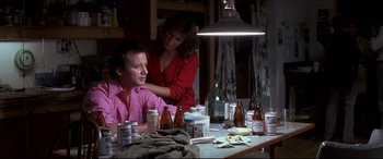 Movie still from “Tootsie” (1982), directed by Sydney Pollack – A man and a woman sitting at a dinner table; Medium shot, Over the shoulder angle