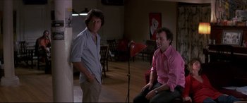 Movie still from “Tootsie” (1982), directed by Sydney Pollack – Two men are sitting in front of a microphone; Medium shot, Low angle