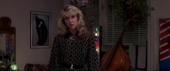 Movie still from “Tootsie” (1982), directed by Sydney Pollack – A woman with blonde hair wearing a polka dot dress; Medium shot, Over the shoulder angle