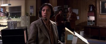 Movie still from “Tootsie” (1982), directed by Sydney Pollack – A woman wearing a headset in a room with other people; Close Up shot, Low angle