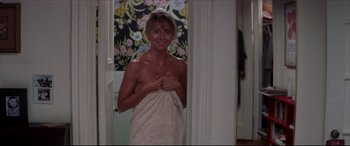Movie still from “Tootsie” (1982), directed by Sydney Pollack – A woman wrapped in a towel in a bathroom; Medium shot, Over the shoulder angle
