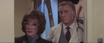 Movie still from “Tootsie” (1982), directed by Sydney Pollack – An older man and a younger woman standing next to each other; Close Up shot, Over the shoulder angle