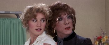 Movie still from “Tootsie” (1982), directed by Sydney Pollack – A woman and a woman wearing glasses looking at each other; Close Up shot, Over the shoulder angle