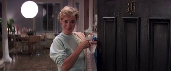 Movie still from “Tootsie” (1982), directed by Sydney Pollack – A young woman holding a bottle and a towel; Medium shot, Low angle