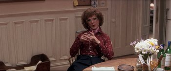 Movie still from “Tootsie” (1982), directed by Sydney Pollack – A woman sitting at a table talking to someone; Medium shot, Over the shoulder angle