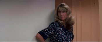 Movie still from “Tootsie” (1982), directed by Sydney Pollack – A woman leaning against a wall with her hand on her hip; Close Up shot, Low angle