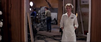 Movie still from “Tootsie” (1982), directed by Sydney Pollack – A woman standing in front of a camera in a room; Medium shot, Over the shoulder angle