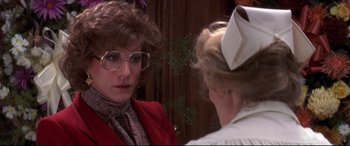 Movie still from “Tootsie” (1982), directed by Sydney Pollack – A woman wearing glasses talking to another woman wearing a hat; Close Up shot, Over the shoulder angle