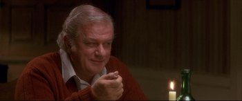Movie still from “Tootsie” (1982), directed by Sydney Pollack – An older man sitting in front of a lit candle; Close Up shot, High angle