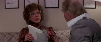 Movie still from “Tootsie” (1982), directed by Sydney Pollack – An older man and a woman sitting on a couch talking; Close Up shot, Over the shoulder angle