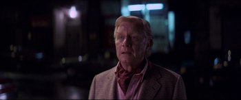 Movie still from “Tootsie” (1982), directed by Sydney Pollack – An old man with a beard and mustache wearing a suit and tie; Close Up shot, Over the shoulder angle