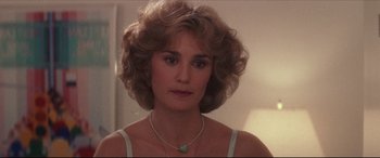 Movie still from “Tootsie” (1982), directed by Sydney Pollack – A person wearing a necklace; Close Up shot, Over the shoulder angle