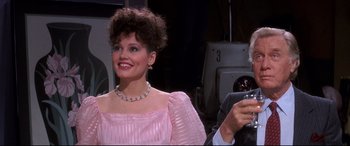 Movie still from “Tootsie” (1982), directed by Sydney Pollack – A person wearing a pink dress; Close Up shot, Over the shoulder angle