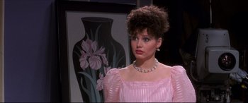 Movie still from “Tootsie” (1982), directed by Sydney Pollack – A person wearing a pink dress; Close Up shot, Over the shoulder angle