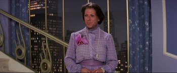 Movie still from “Tootsie” (1982), directed by Sydney Pollack – A woman in a purple dress with a purple flower in her hand; Medium shot, Over the shoulder angle