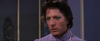 Movie still from “Tootsie” (1982), directed by Sydney Pollack – A person wearing a necklace; Close Up shot, Over the shoulder angle