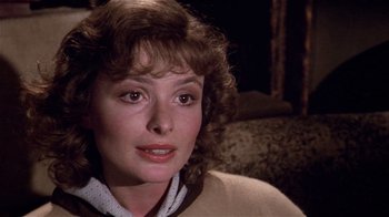 Movie still from “Top Secret!” (1984), directed by Jim Abrahams – A person wearing a jacket; Close Up shot, Over the shoulder angle