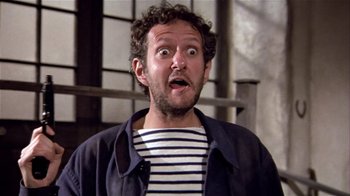 Movie still from “Top Secret!” (1984), directed by Jim Abrahams – A person with a surprised look on his face; Close Up shot, Low angle