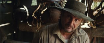 Movie still from “Tracks” (2013), directed by John Curran – A person wearing a hat; Close Up shot, Low angle