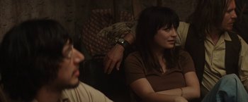 Movie still from “Tracks” (2013), directed by John Curran – A man and a woman sitting next to each other in a room; Medium shot, Over the shoulder angle