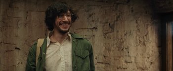 Movie still from “Tracks” (2013), directed by John Curran – A man wearing a green jacket and a white shirt; Close Up shot, Over the shoulder angle