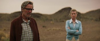 Movie still from “Tracks” (2013), directed by John Curran – A man and a woman standing next to each other in the desert; Medium shot, Over the shoulder angle