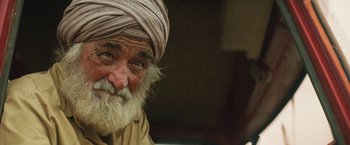 Movie still from “Tracks” (2013), directed by John Curran – An old man with a beard and a turban; Close Up shot, Over the shoulder angle