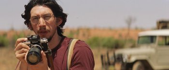 Movie still from “Tracks” (2013), directed by John Curran – A person wearing a red shirt; Close Up shot, Over the shoulder angle