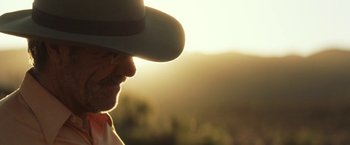 Movie still from “Tracks” (2013), directed by John Curran – A person wearing a cowboy hat; Extreme Close Up shot, Low angle