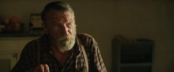 Movie still from “Tracks” (2013), directed by John Curran – An older man with a beard and a mustache; Close Up shot, Over the shoulder angle