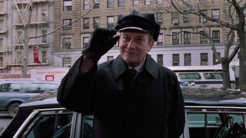 Movie still from “Trading Places” (1983), directed by John Landis – An older man wearing a hat and a coat; Medium shot, Low angle