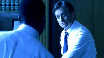 Movie still from “Traffic” (2000), directed by Steven Soderbergh – A man wearing a blue tie looking at himself in the mirror; Close Up shot, Over the shoulder angle