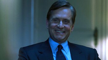 Movie still from “Traffic” (2000), directed by Steven Soderbergh – A person wearing a suit and tie; Close Up shot, Low angle