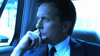 Movie still from “Traffic” (2000), directed by Steven Soderbergh – A person wearing a suit and tie; Close Up shot, Low angle
