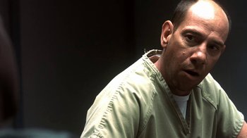 Movie still from “Traffic” (2000), directed by Steven Soderbergh – A person wearing a shirt and a jacket; Close Up shot, Over the shoulder angle