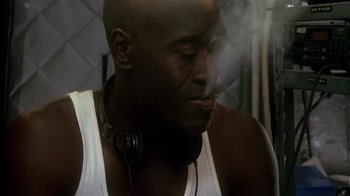 Movie still from “Traffic” (2000), directed by Steven Soderbergh – A person wearing a tank top; Close Up shot, Low angle