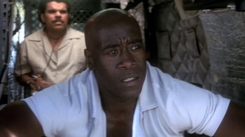 Movie still from “Traffic” (2000), directed by Steven Soderbergh – A person wearing a white shirt; Close Up shot, High angle