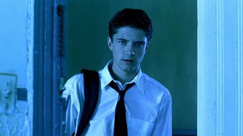 Movie still from “Traffic” (2000), directed by Steven Soderbergh – A man in a white shirt and a black tie; Close Up shot, Low angle