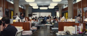 Movie still from “Trainwreck” (2015), directed by Judd Apatow – A group of people sitting at tables with laptops; Wide shot, High angle