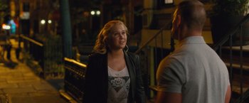 Movie still from “Trainwreck” (2015), directed by Judd Apatow – A woman standing next to a man on a bridge; Medium shot, Over the shoulder angle